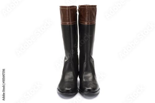 brown and black leather childrens boot on white background