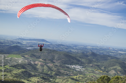  Deporte de riesgo, Persona volando en parapente photo