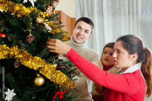  family of three preparing for Christmas