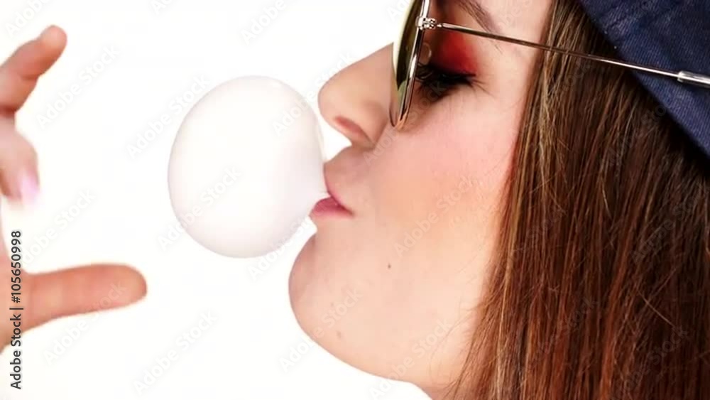 Woman doing bubble with chewing gum 4K