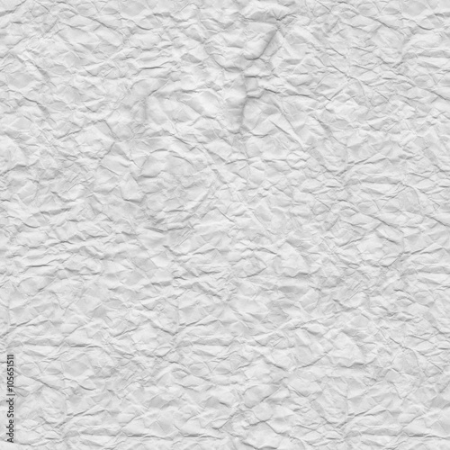 Crumpled white paper. Texture sheet background. Seamless tileabl