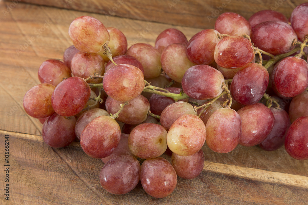 Delicious grapes on wooden background Delicious grapes on wooden background