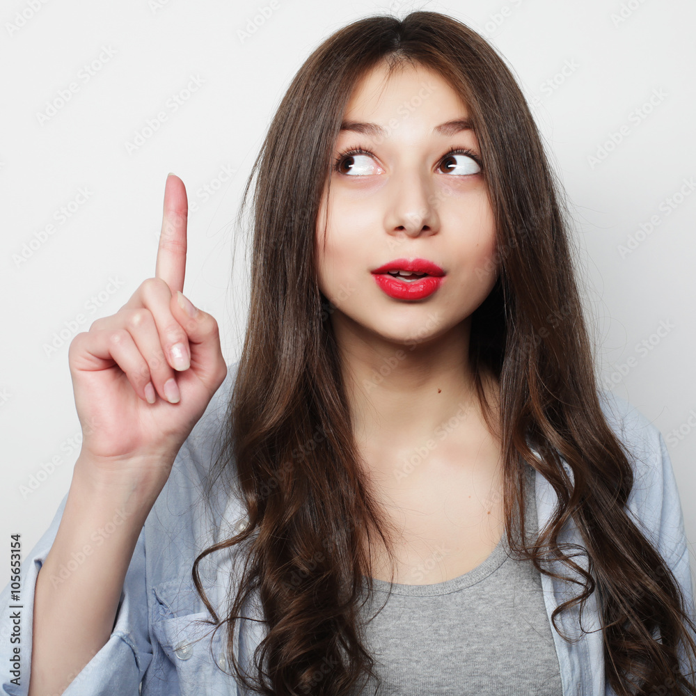 Beautiful young surprised woman.