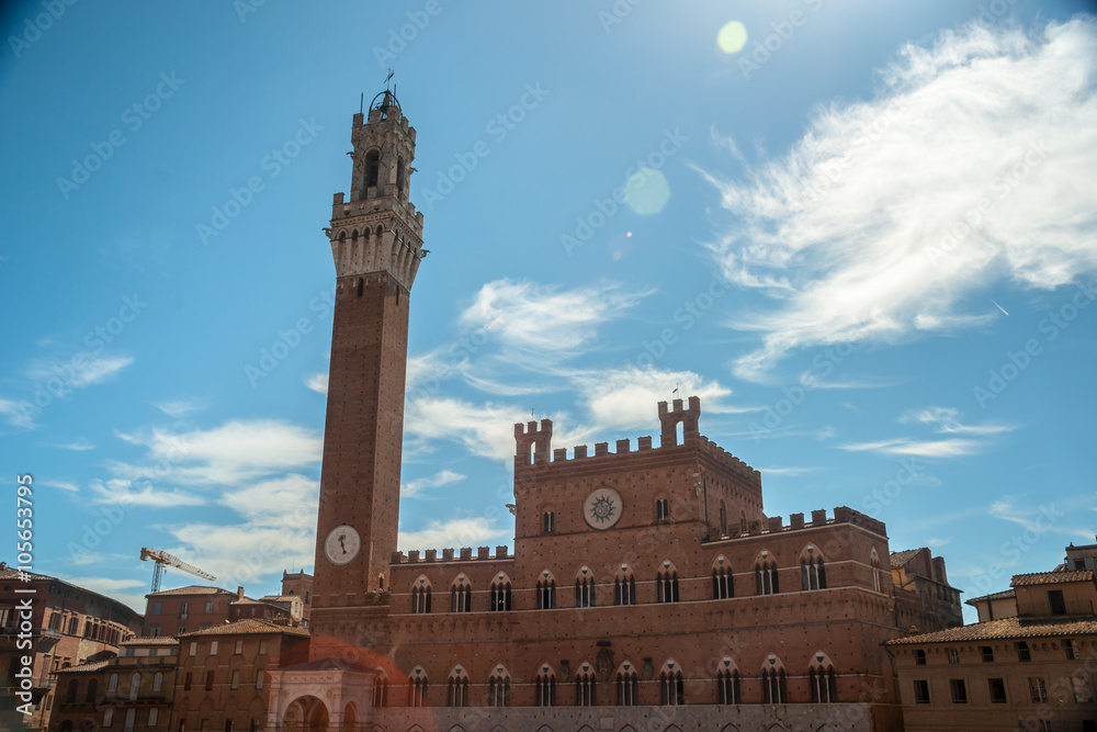 Panorama of Siena, Tuscany, Italy. Piazza del Campo with Palazzo Pubblico and its Torre del Mangia. Beautiful image of medieval italian town.