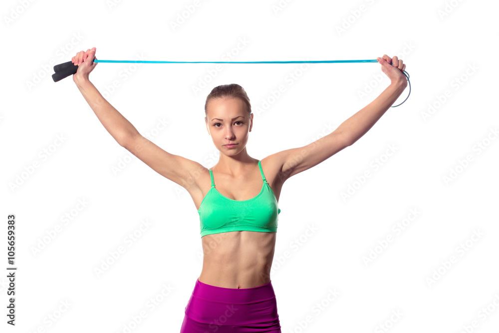 young woman with healthy sporty figure holding skipping rope young woman with healthy sporty figure holding skipping rope