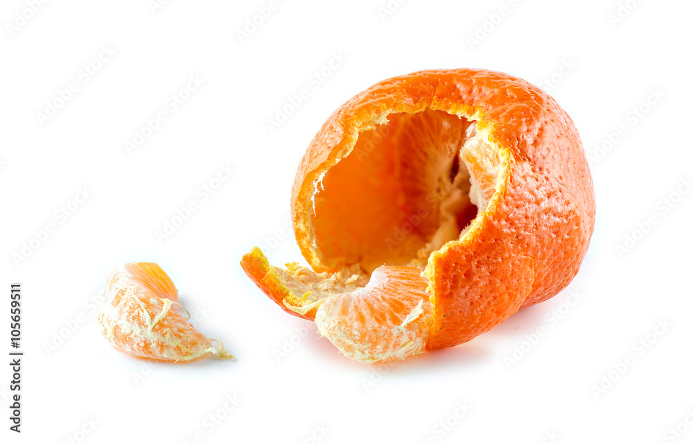 Mandarin with half peeled skin and pieces of citrus against whit Mandarin with half peeled skin and pieces of citrus against whit