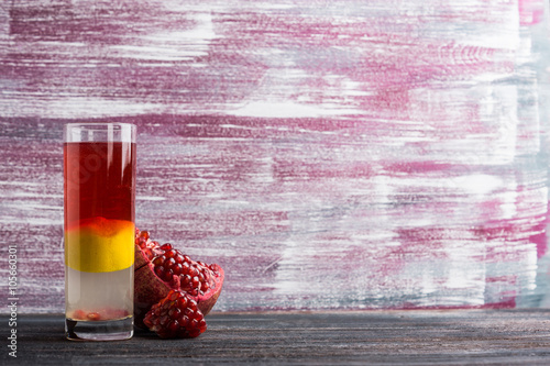 Layred cocktail on the wooden background photo