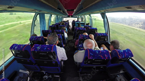 Luxury tourist bus full of passengers traveling in Alps