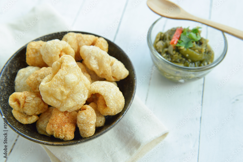 Pork rinds also known as chicharon or chicharrones, deep fried p Pork rinds also known as chicharon or chicharrones, deep fried p