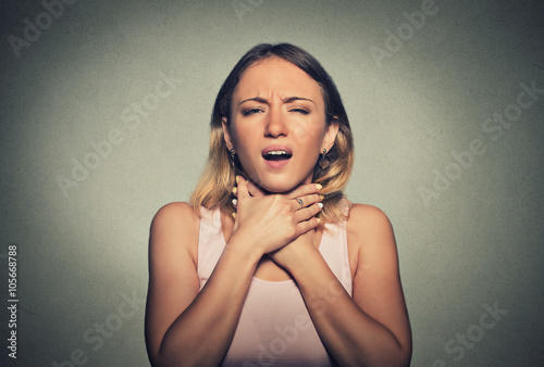 Fototapete Young woman having asthma attack or choking can't breath