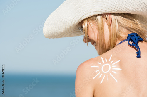 Woman with sunscreen photo