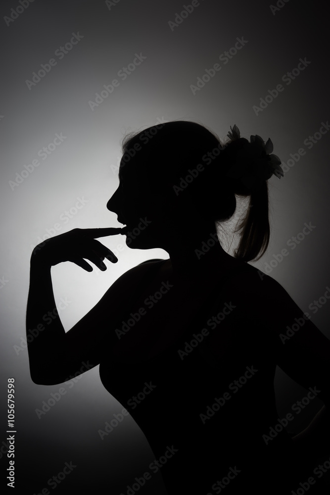Silhouette of beautiful young woman