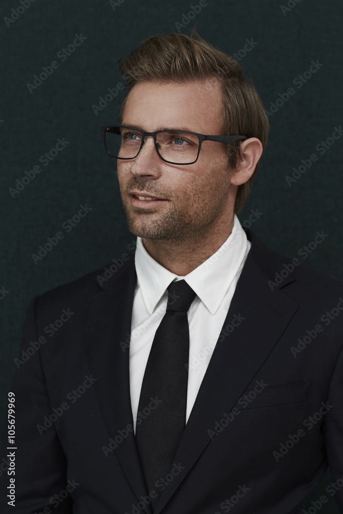 Smart dressed man in suit, looking away