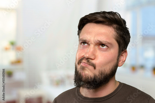 Brutal bearded man thinking