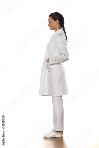 profile of a young woman doctor in uniform on a white background
