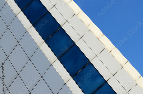Architecture abstract blue glass wall on sky background for business design