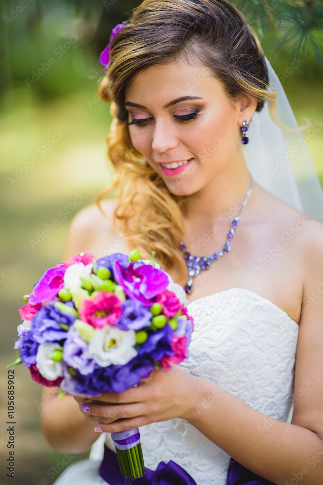 The girl in a wedding dress with purple bow The girl in a wedding dress with purple bow