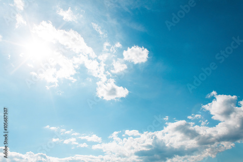 White Clouds on the blue sky with sun shines