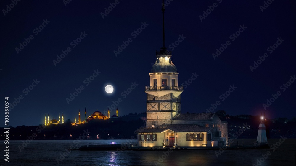 Maiden's Tower in Istanbul at night with Hagia Sophia and The Blue Mosque on the background Maiden's Tower in Istanbul at night with Hagia Sophia and The Blue Mosque on the background