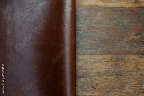 brown leather and rustic wood background