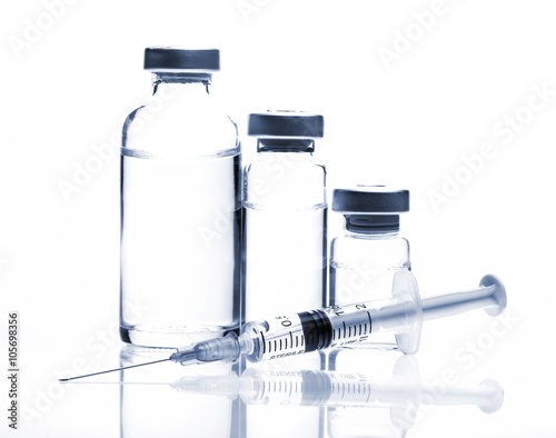 Glass Medicine Vials and Syringe on white background