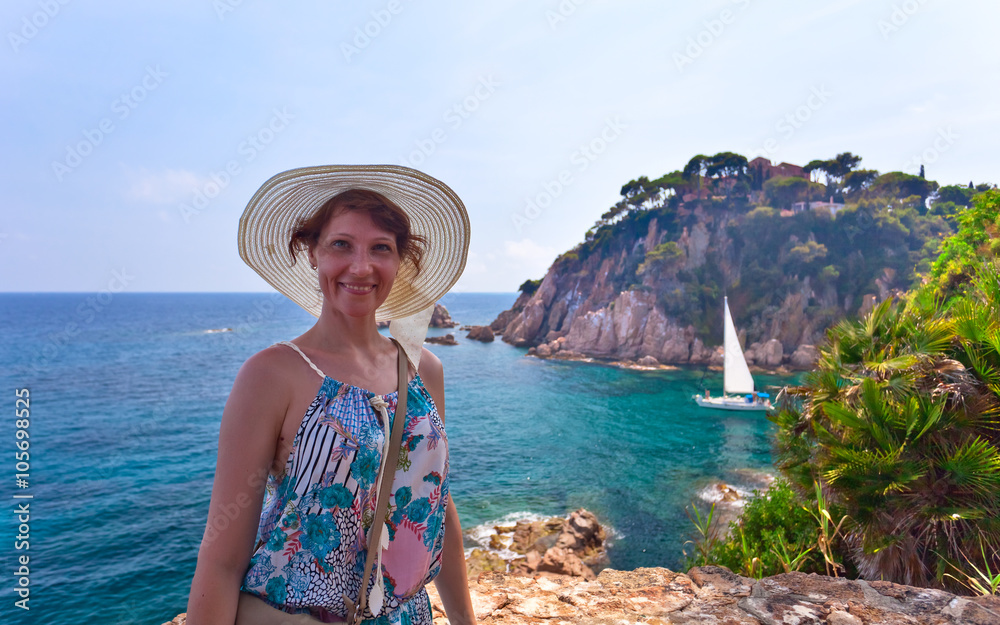 Happy woman on Mediterranean coast of Spain