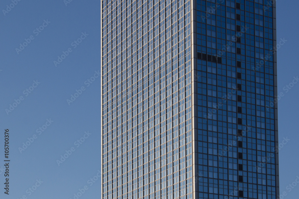 skyscraper - highrise building exterior on blue sky skyscraper - highrise building exterior on blue sky