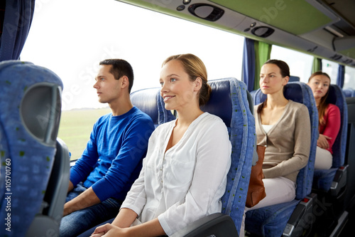 group of happy passengers in travel bus