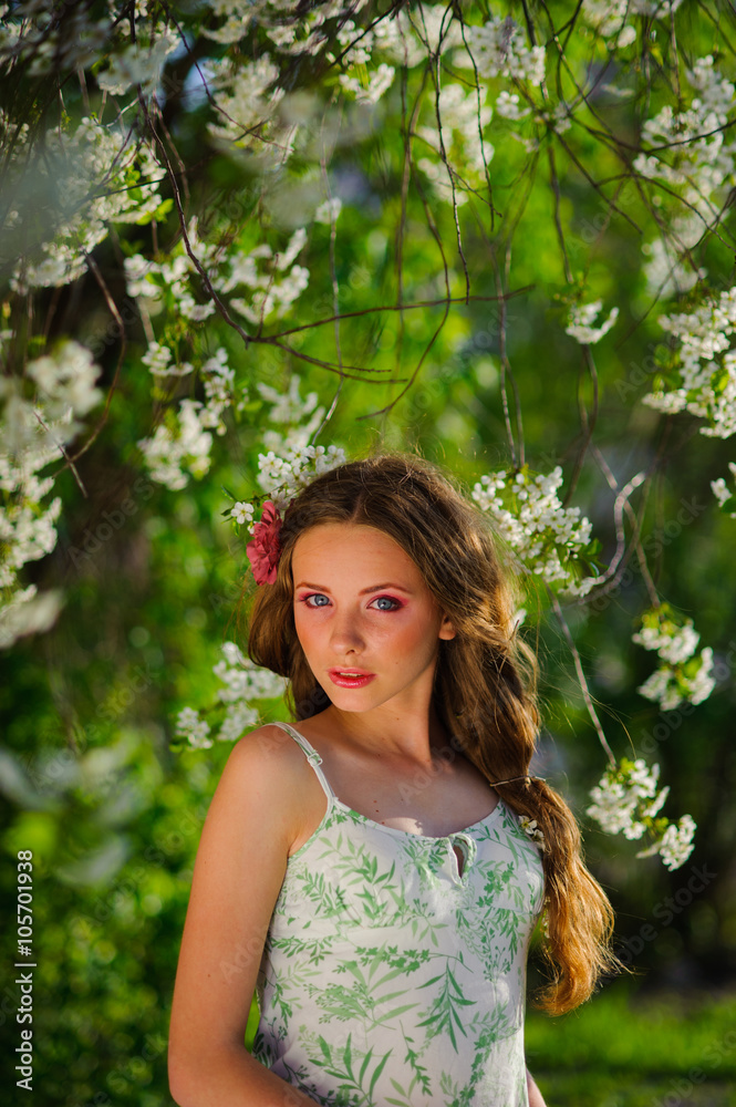 beautiful  woman in a spring garden