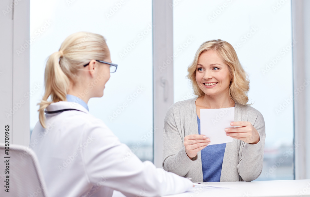 doctor giving prescription to woman at hospital doctor giving prescription to woman at hospital