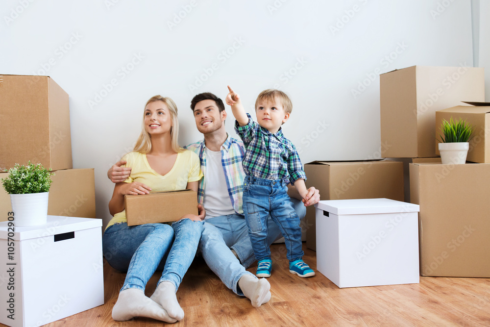 happy family with boxes moving to new home happy family with boxes moving to new home