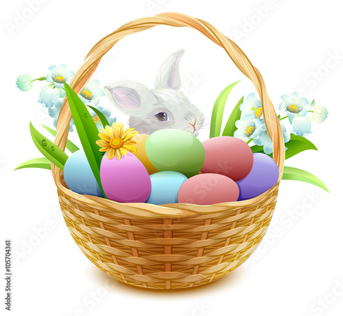 Wicker basket with Easter eggs, flowers and bunny