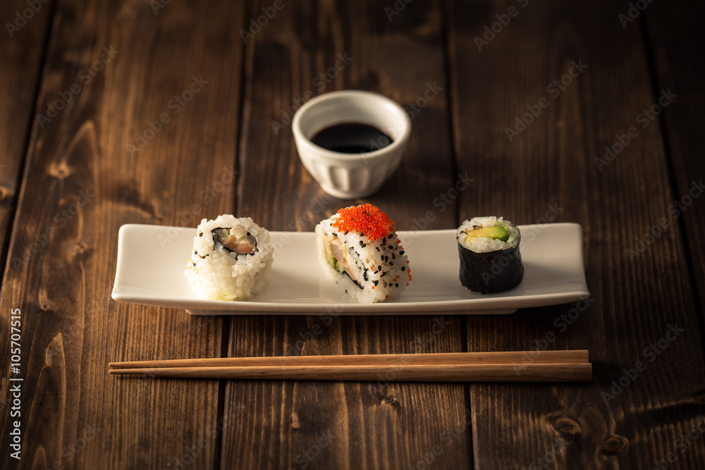 Maki sushi on a wooden table