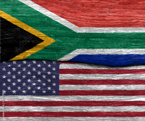 usa flag and south africa flag on wood texture