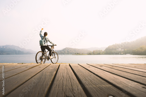 Young woman biking.