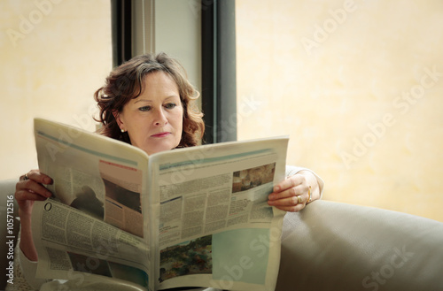 Woman reading the newspaper