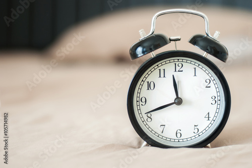 black alarm clock with background soft