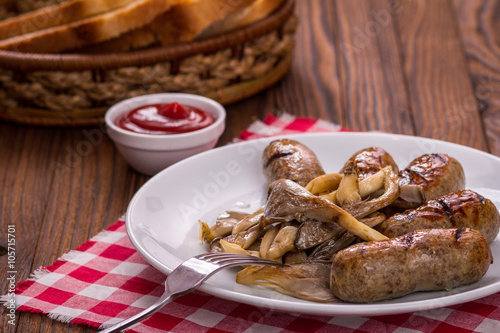 sausages and mushrooms on a plate