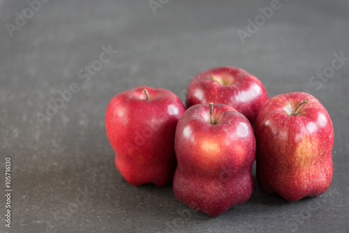 Red apples on grunge background