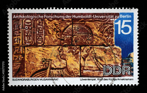 Stamp printed in GDR shows Sudanese Archaeological Excavations by Humboldt University Expedition, head of the King Arnekhamani, reproduce carvings unearthed at Lions Temple, Musawwarat, circa 1970 photo