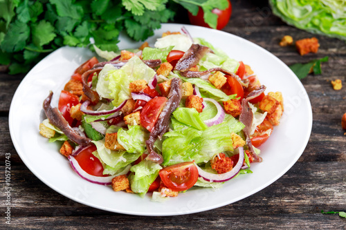 Fresh healthy Classic Caesar salad with anchovies.