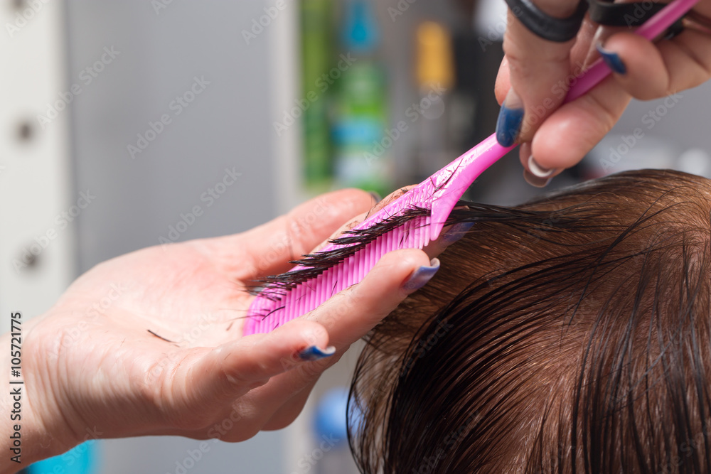 Female hair cutting scissors in a beauty salon Female hair cutting scissors in a beauty salon