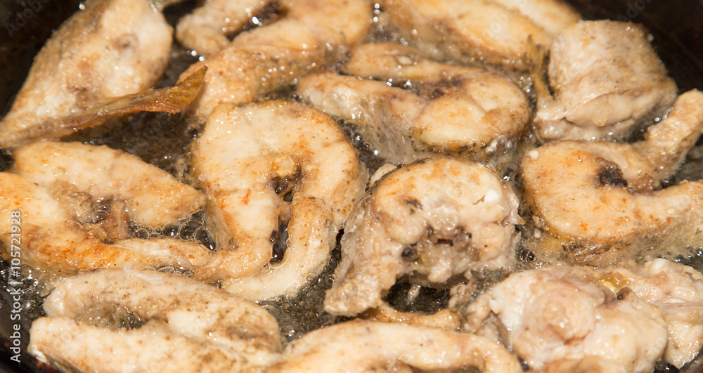fish is fried in a pan in butter fish is fried in a pan in butter