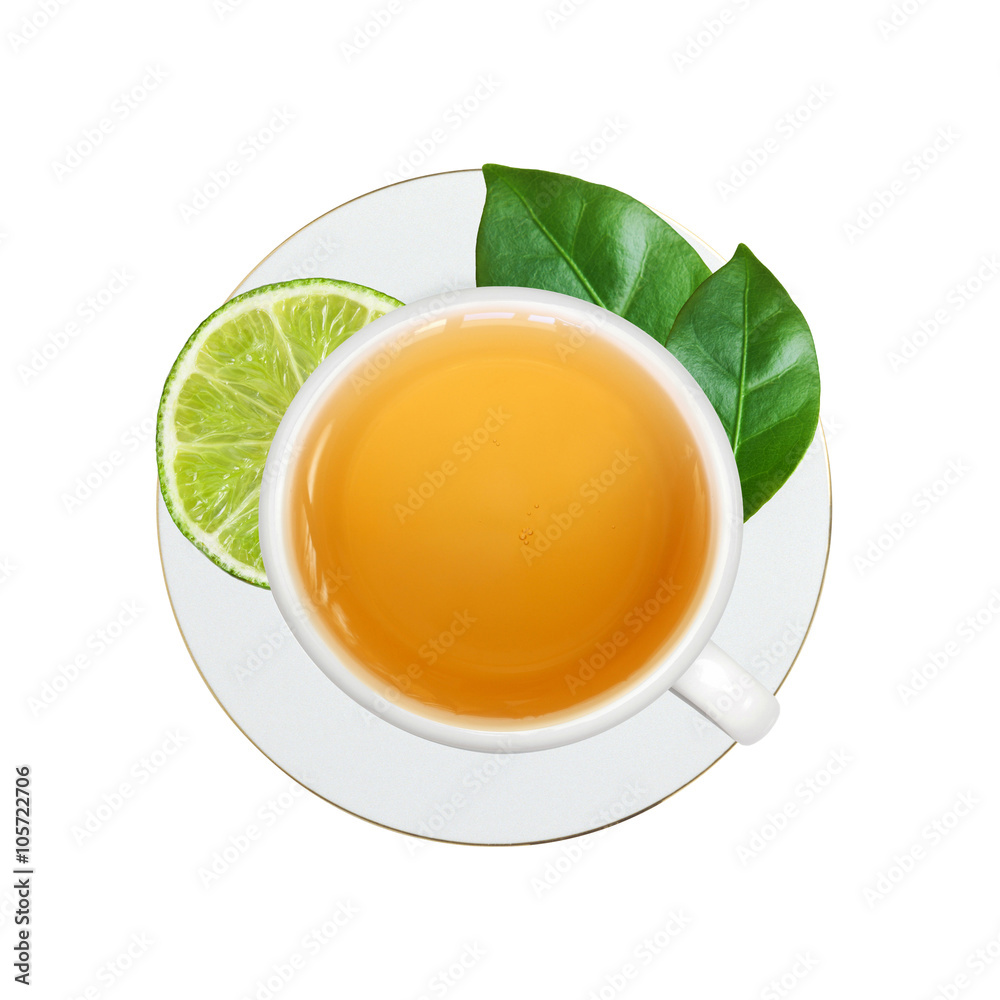 white cup with tea, lime and green leaves isolated on white white cup with tea, lime and green leaves isolated on white
