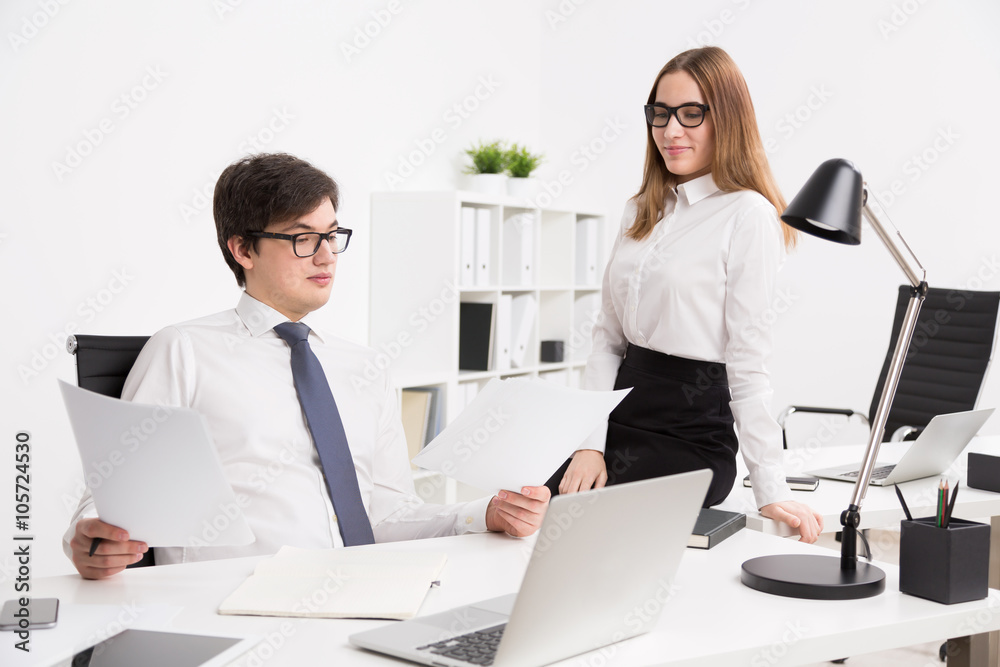 Businessman and businesswoman in office Businessman and businesswoman in office