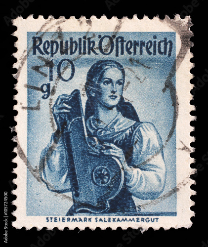 Stamp printed in Austria shows image woman in national Austrian costumes  Styria  Salzkammergut  series  circa 1948