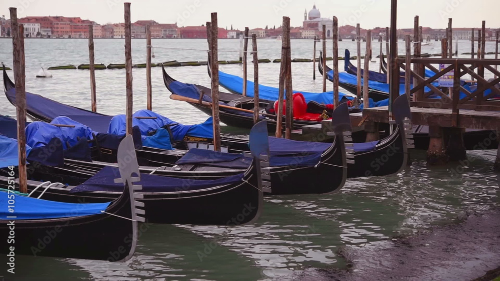 Close-up gondolas sway on the waves in Venice Close-up gondolas sway on the waves in Venice