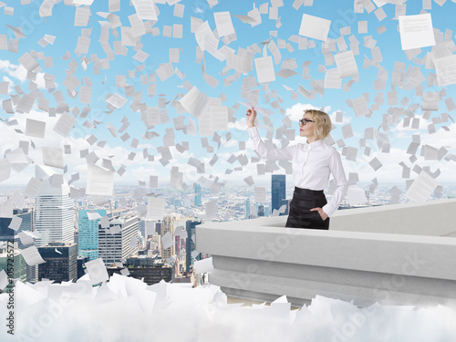 Businesswoman with paper plane