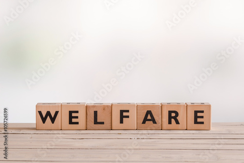 Welfare sign made of wooden cubes photo