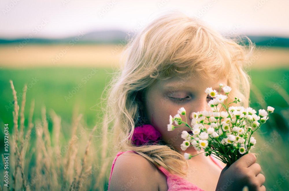 kid with bunch of flowers kid with bunch of flowers